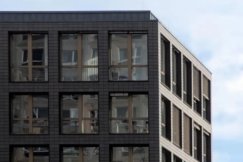 Apartment building used as a neutral backdrop, not a bank branch